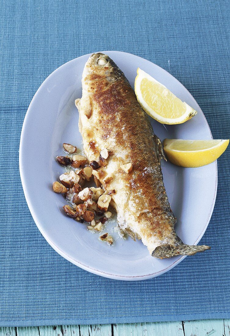 Fried trout with hazelnuts and lemon