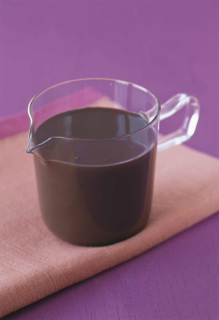 Chocolate sauce in glass jug