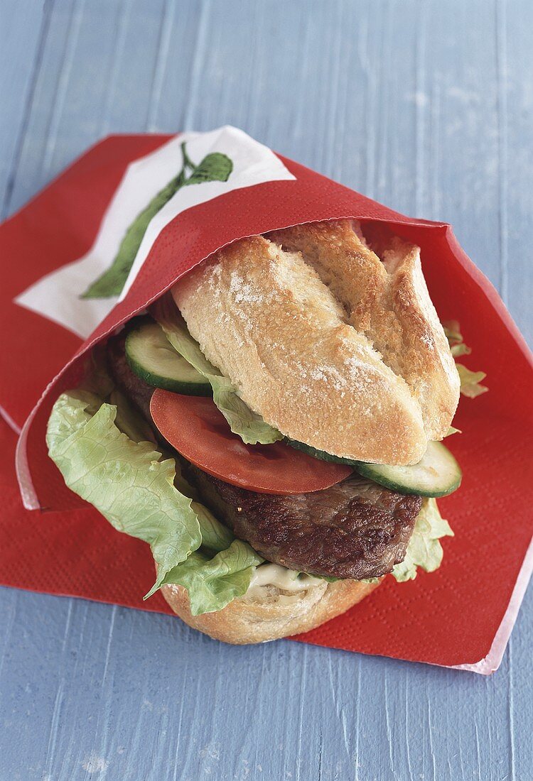 Steak sandwich with tomatoes and cucumber