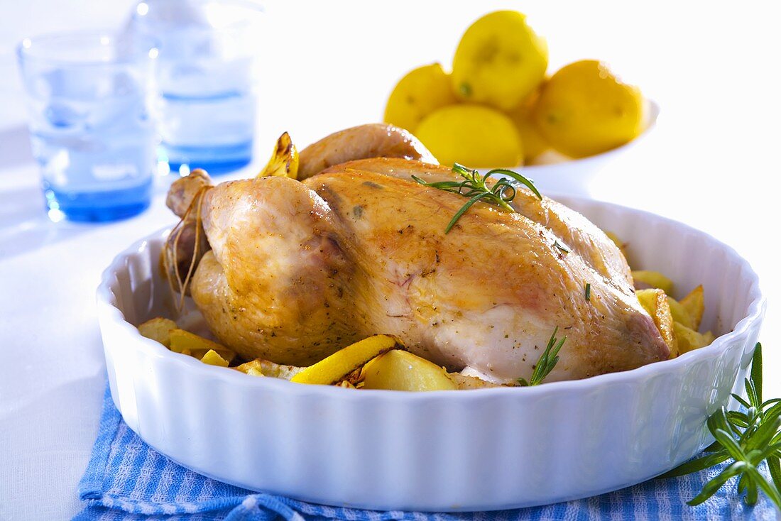 Stuffed chicken with rosemary, potatoes and lemons