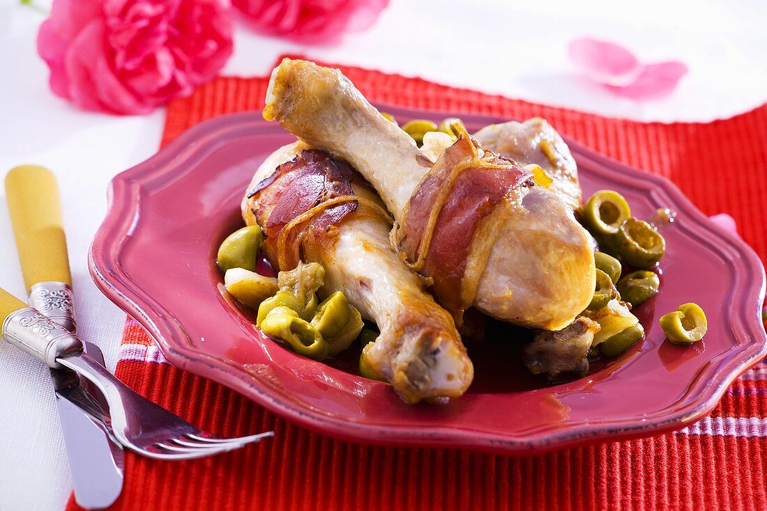 Ham-wrapped chicken drumsticks with olives