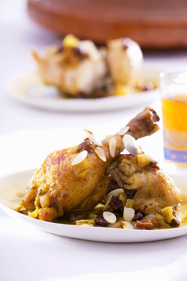 Chicken legs with almonds, raisins and onions (North Africa)