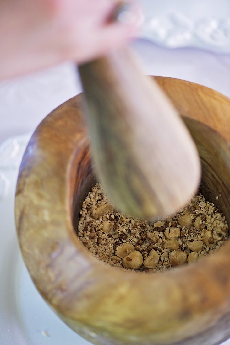 Dukkah (Middle Eastern spice mixture with hazelnuts & sesame seeds) in mortar