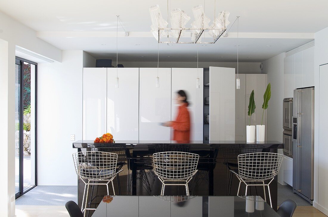 Woman in dining room of an architect-designed house