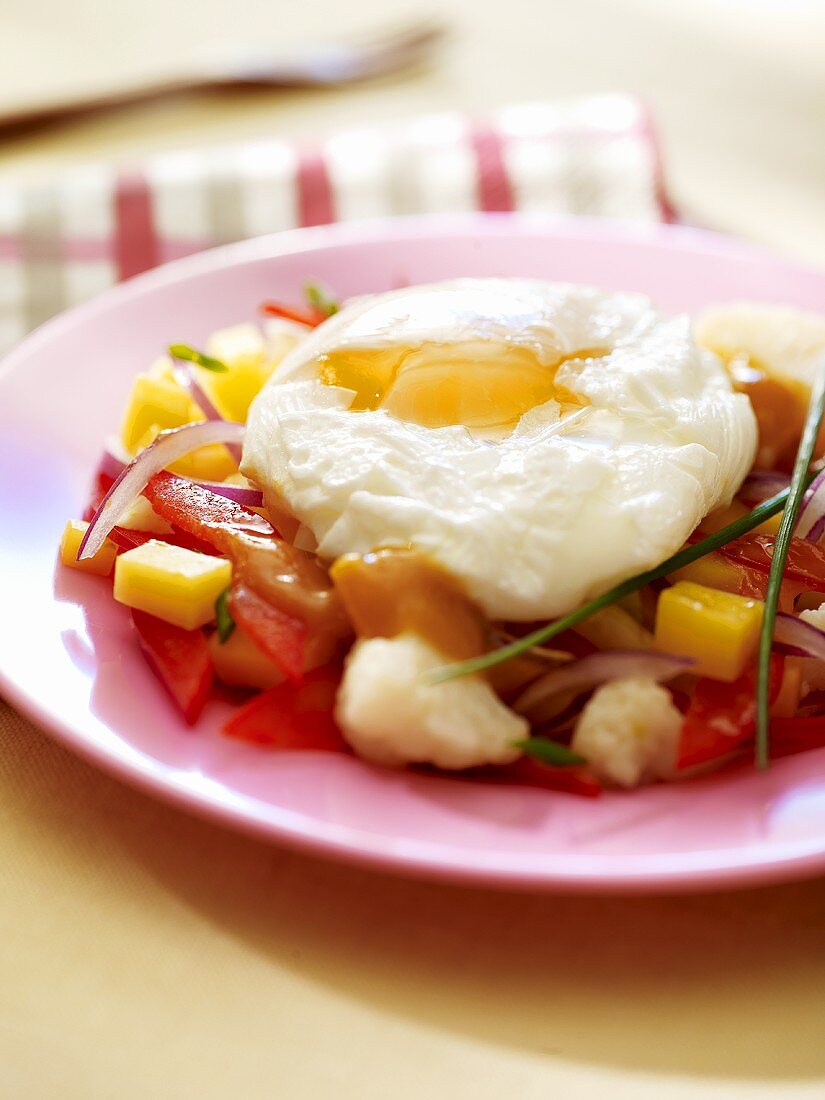 Poached egg on bed of vegetables