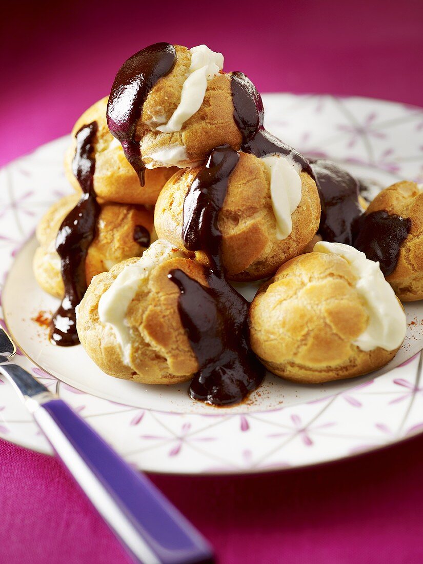 Profiteroles with white and dark chocolate filling