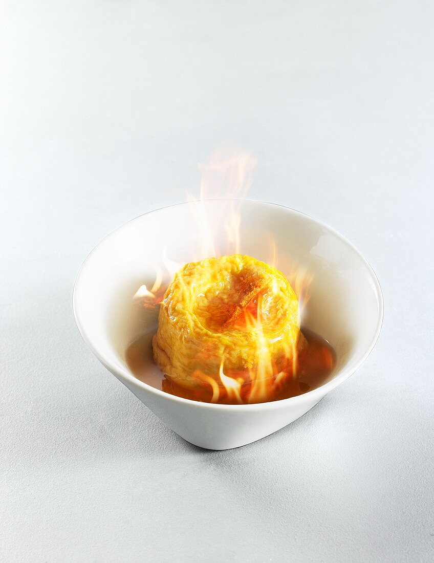 Langres (soft French cheese) flambéed in Armagnac