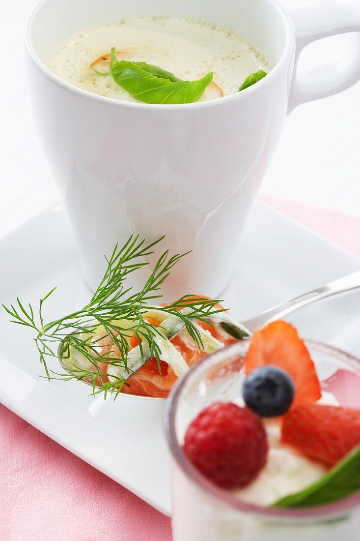 Curry soup, salmon with cucumber and dill and coffee panna cotta with berries