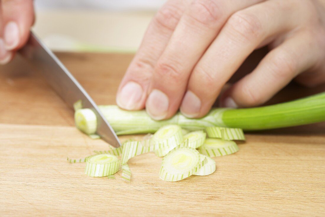 Man chopping leek, close-up