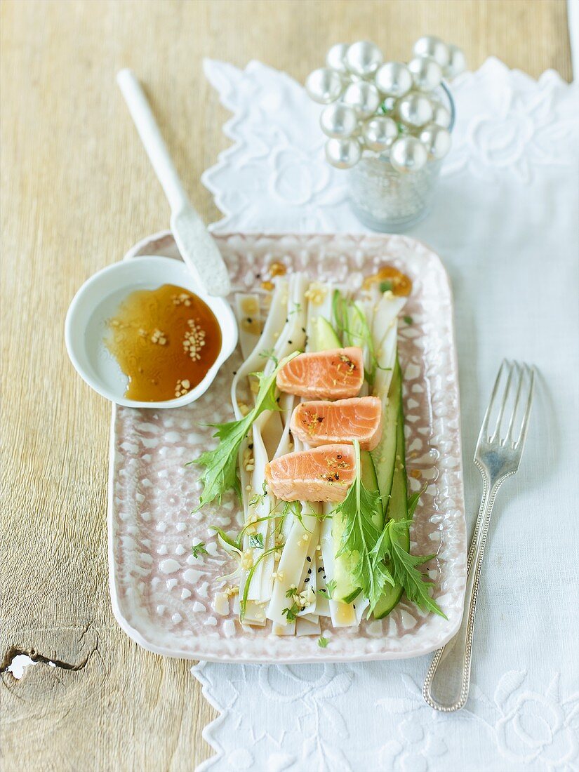 Salmon tataki on cucumber salad