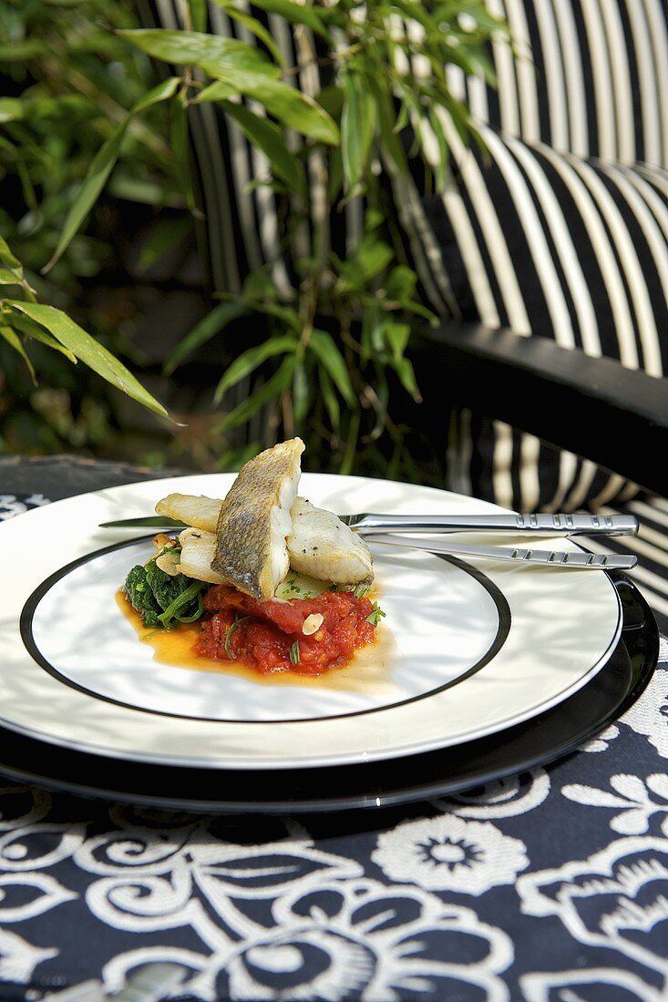 Sea bass on tomatoes