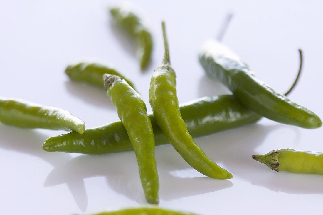 Several fresh green chillies