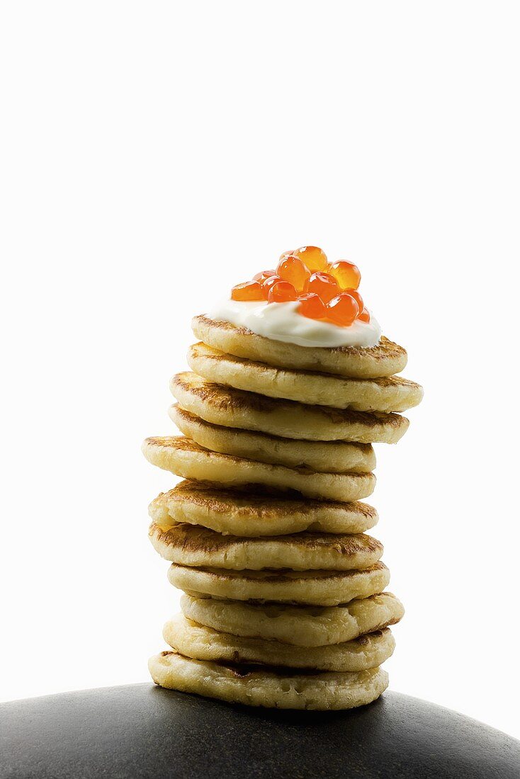 Blinis with sour cream and salmon caviar