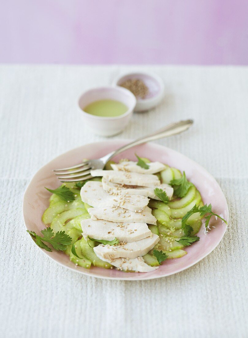 Cucumber carpaccio with ginger chicken and sesame seeds