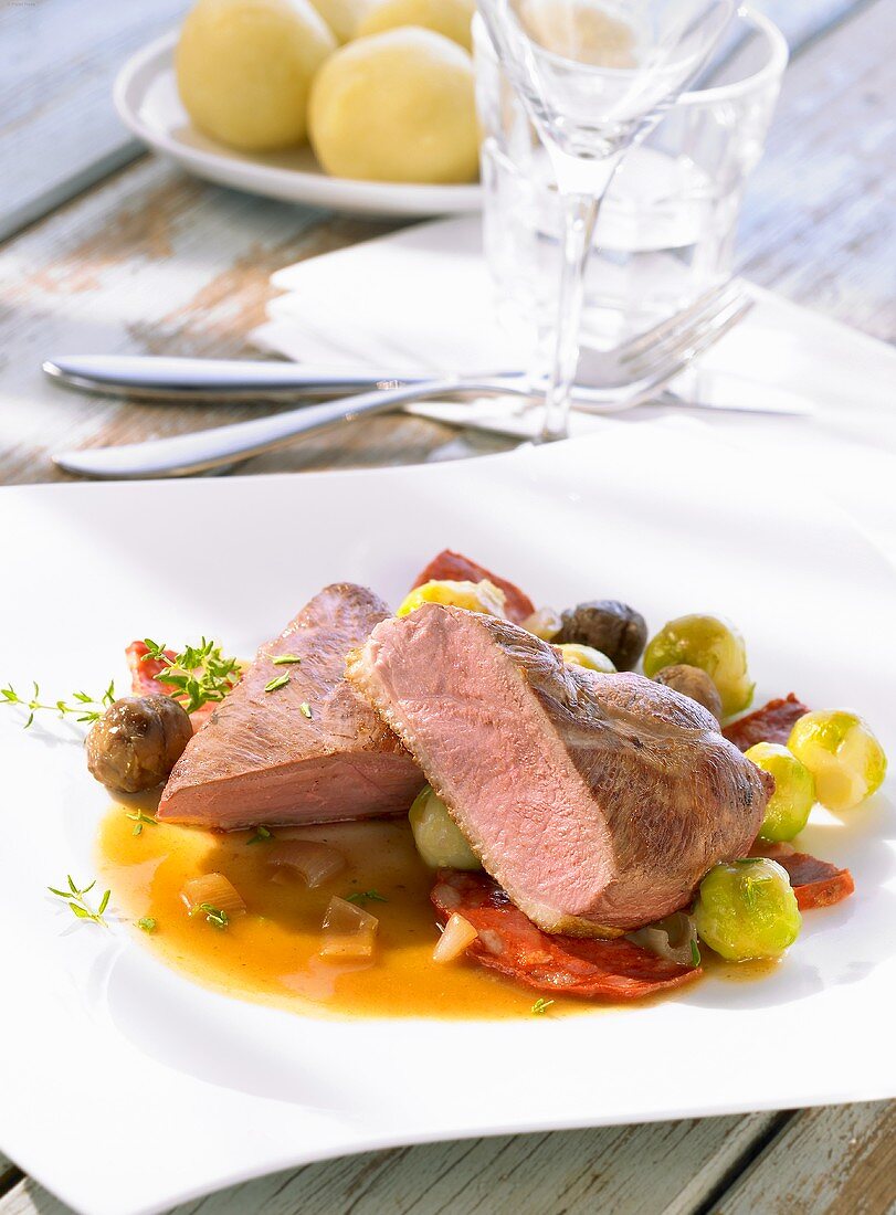 Roast duck breast with chestnuts and Brussels sprouts