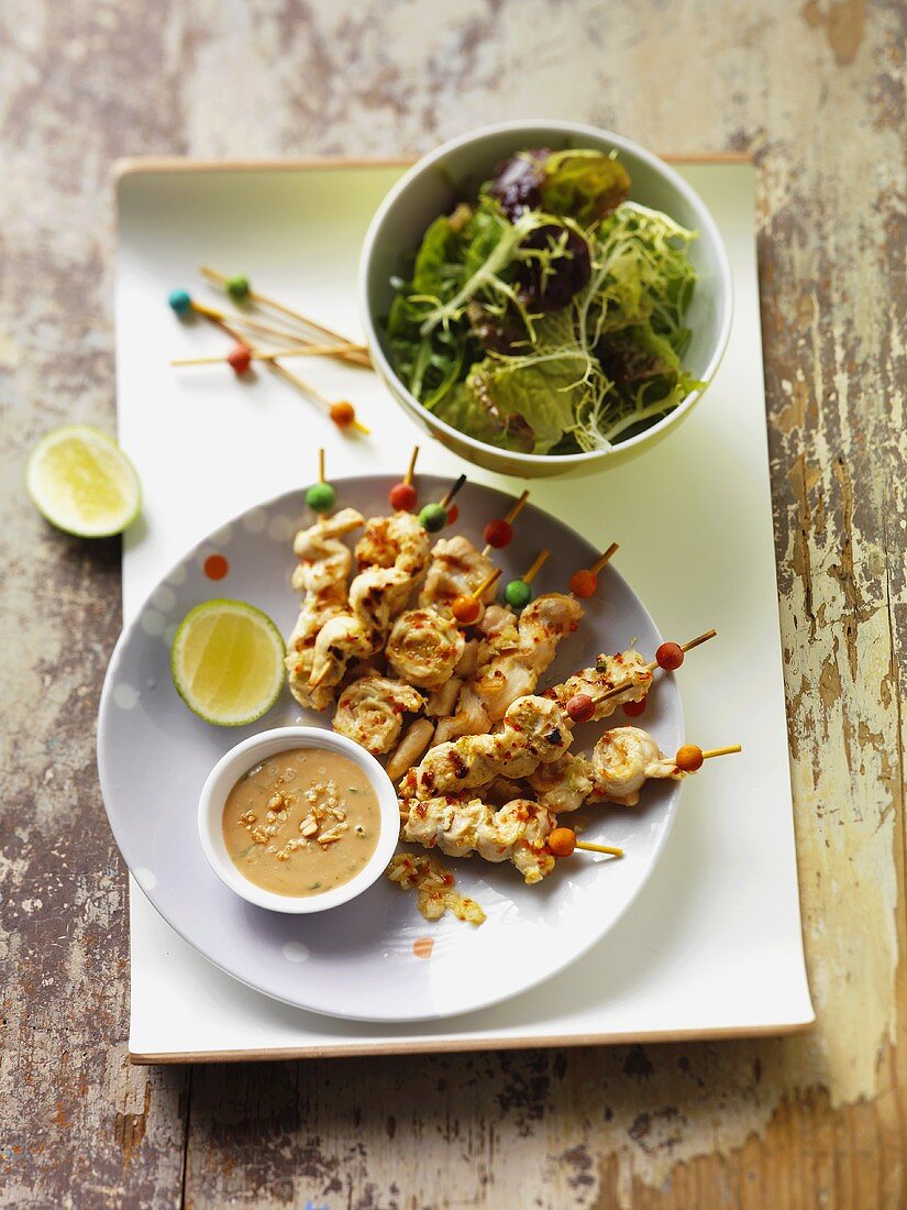 Chicken satay with chilli peanut sauce and salad leaves