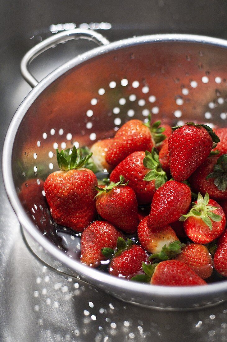 Fresh strawberries in colander