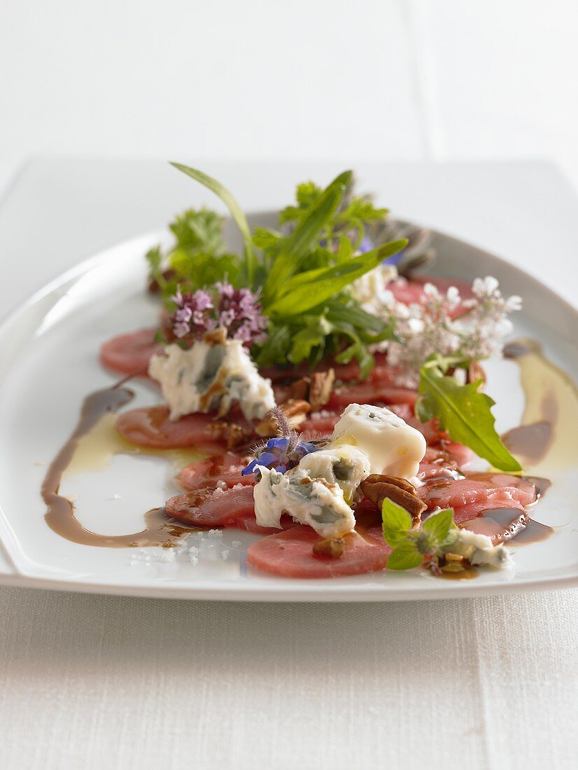 Veal carpaccio with pecan nuts and blue cheese
