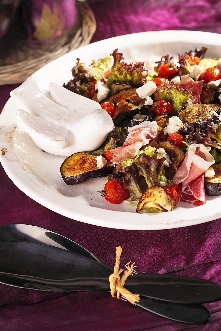 Aubergine salad with raw ham and cherry tomatoes