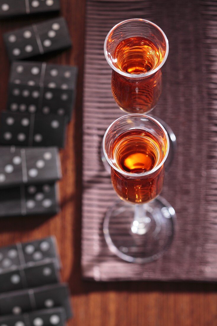 Two glasses of quince liqueur