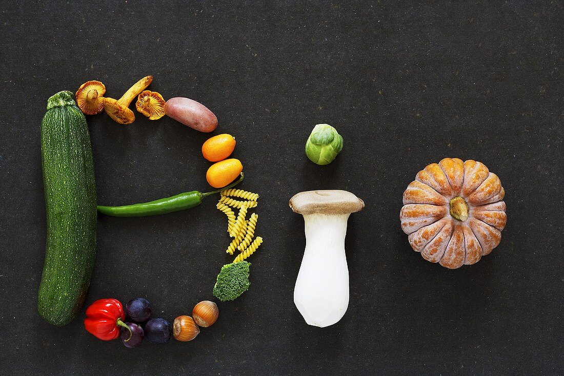 The word 'BIO' written in vegetables, mushrooms, fruit and nuts