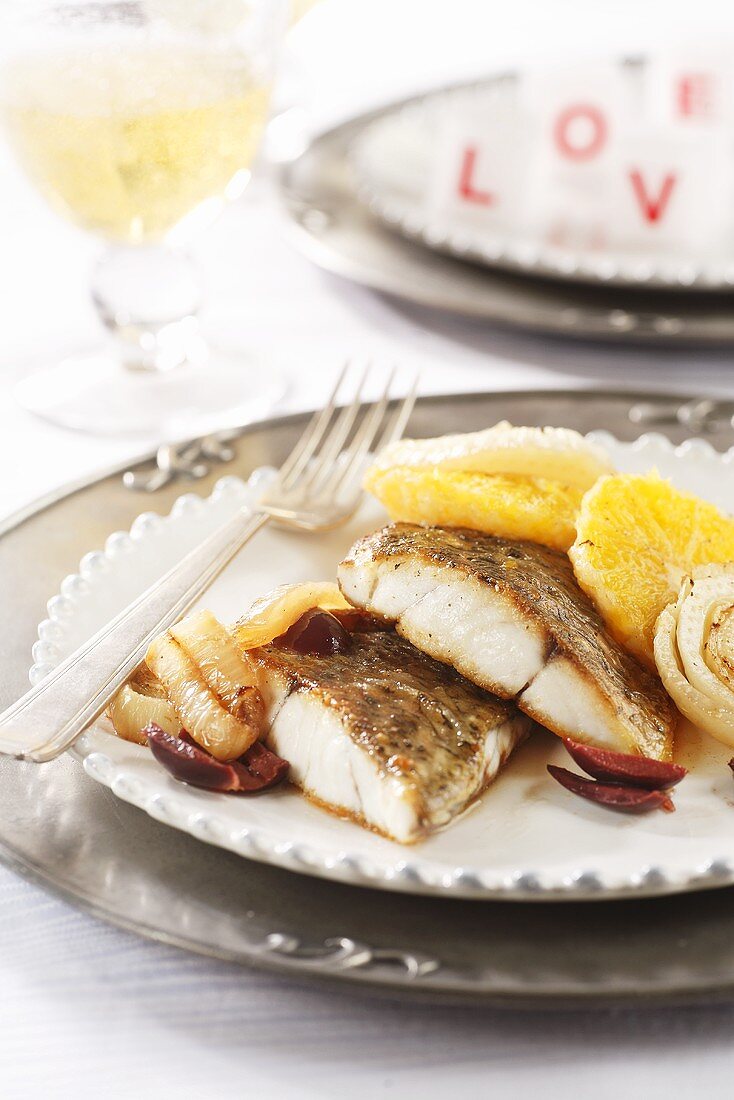 Fish with fennel, orange slices and olives