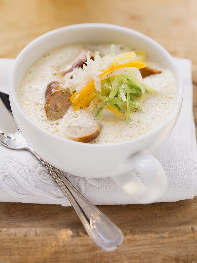 Cream of root vegetable soup with sausages