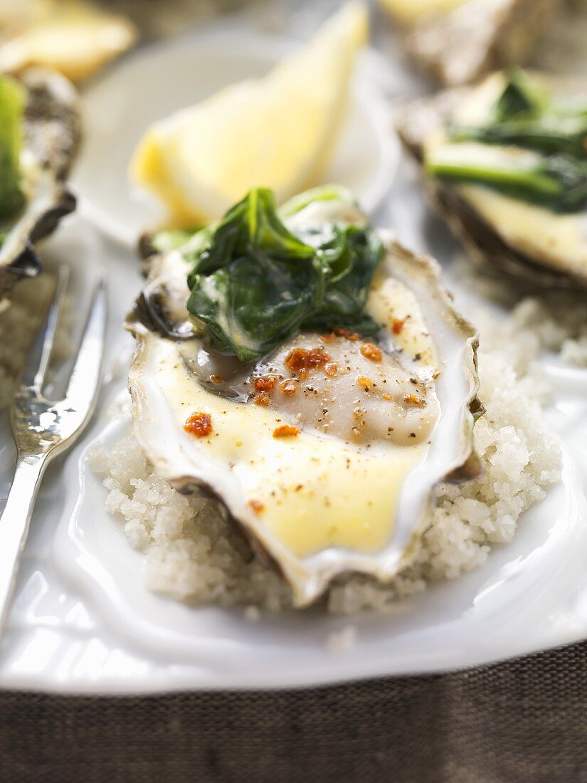 Oysters on spinach with spicy hollandaise sauce
