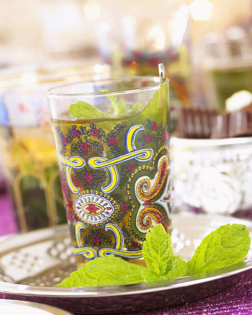 Mint tea with fresh mint leaves in a glass