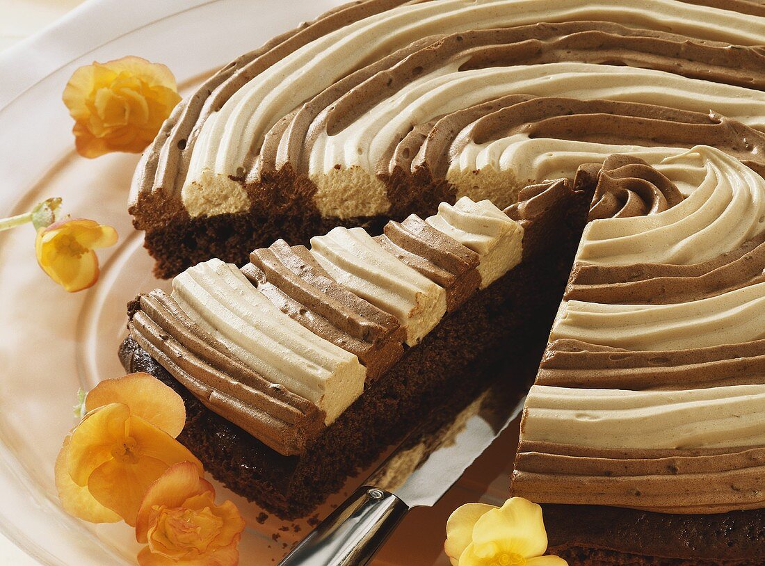 Cappuccino cake, partly sliced