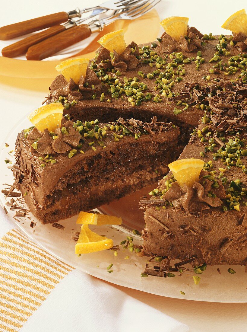 Chocolate cake with pistachios and pieces of orange