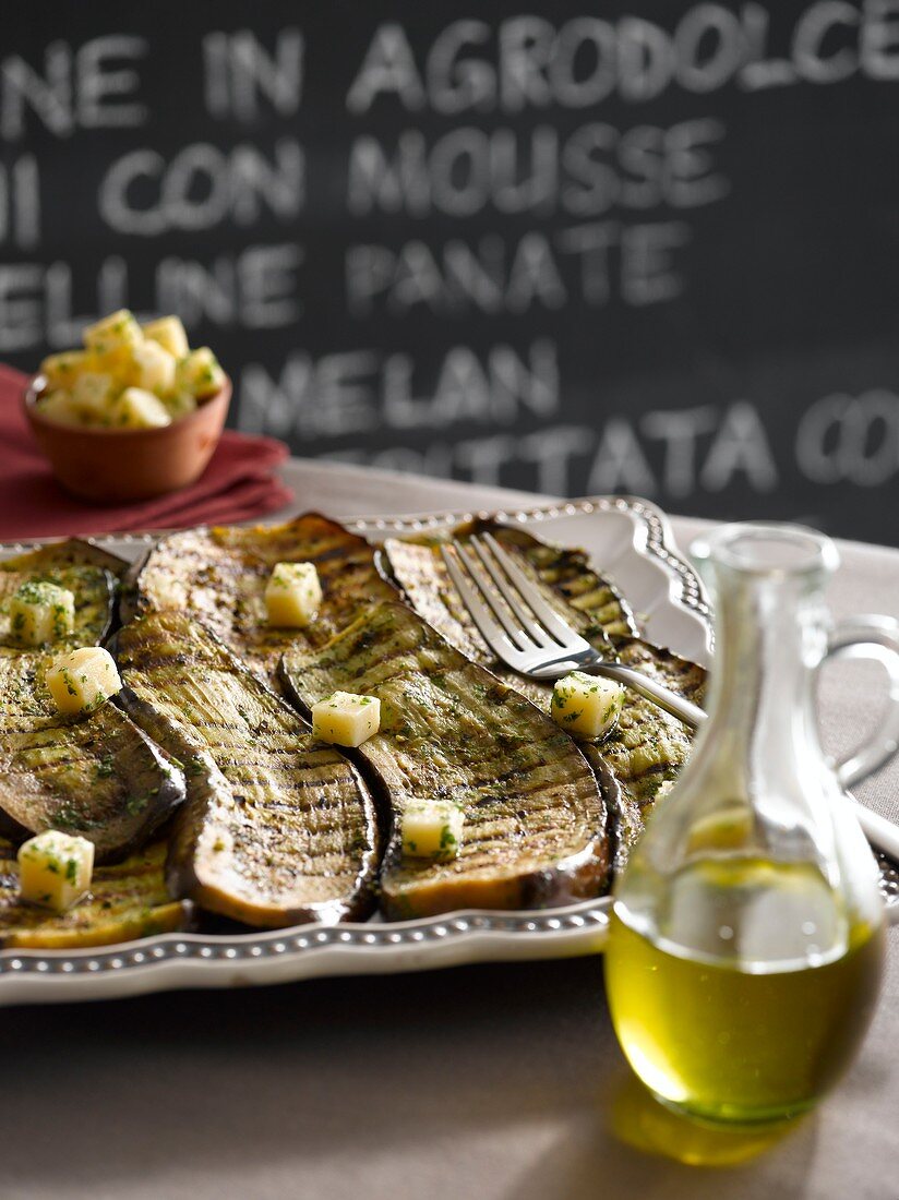 Barbecued aubergine slices with parsley pesto and marinated Parmesan