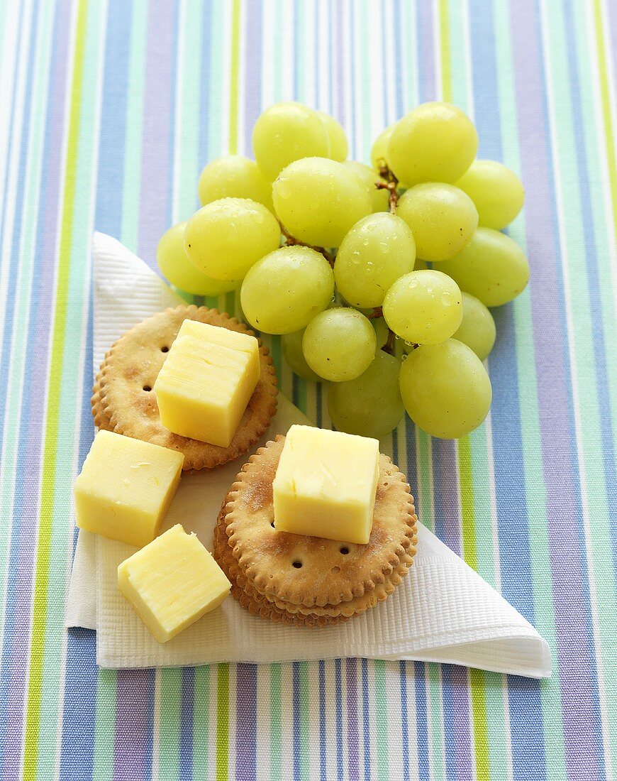 Crackers with cheese and grapes
