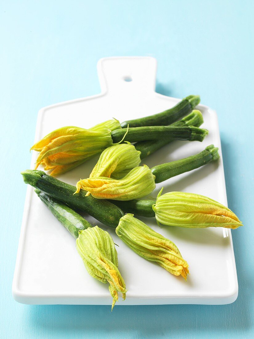 Courgette flowers on chopping board