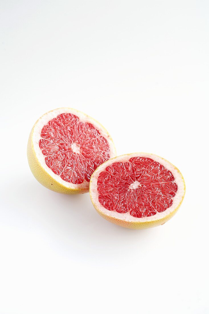 Halved pink grapefruit