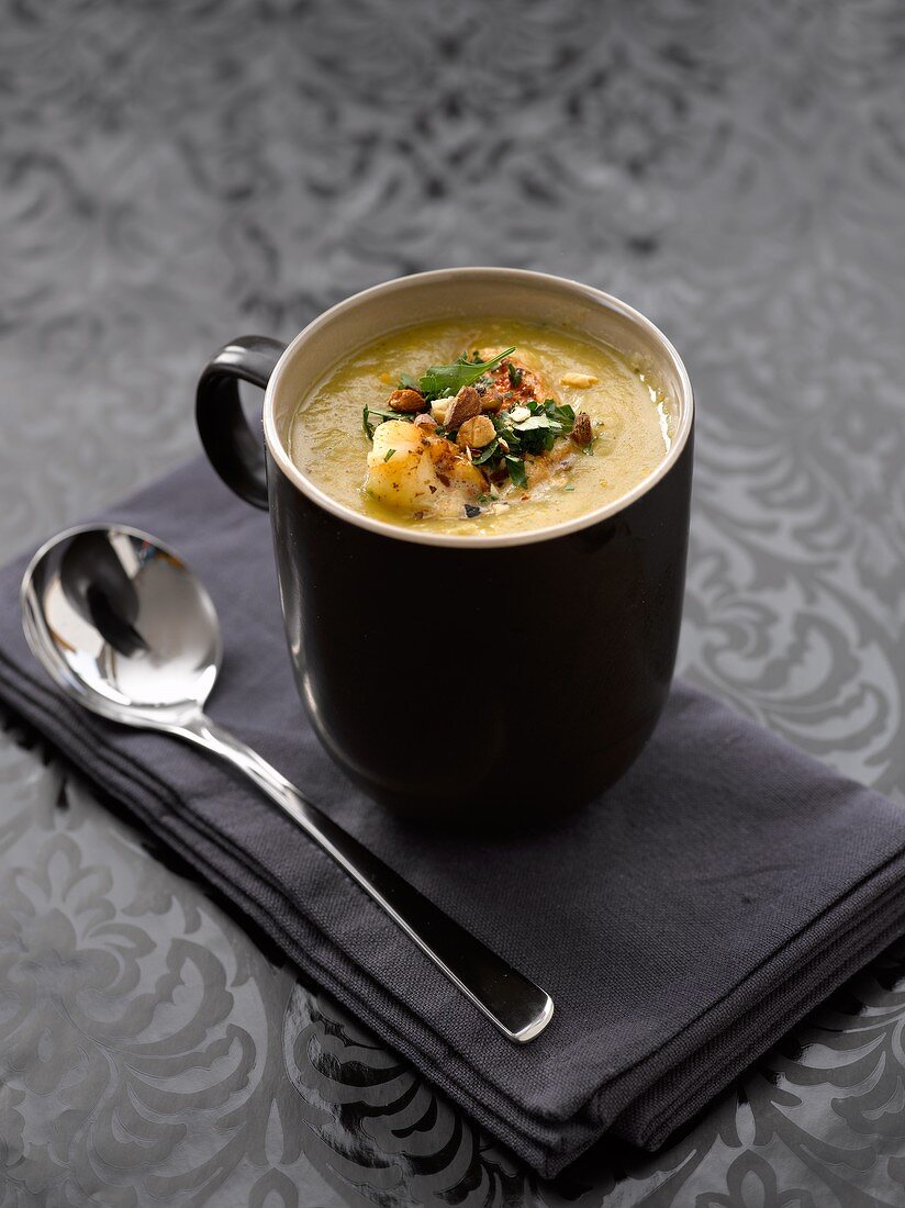 Celeriac, leek and orange soup with toasted almonds and fried lobster