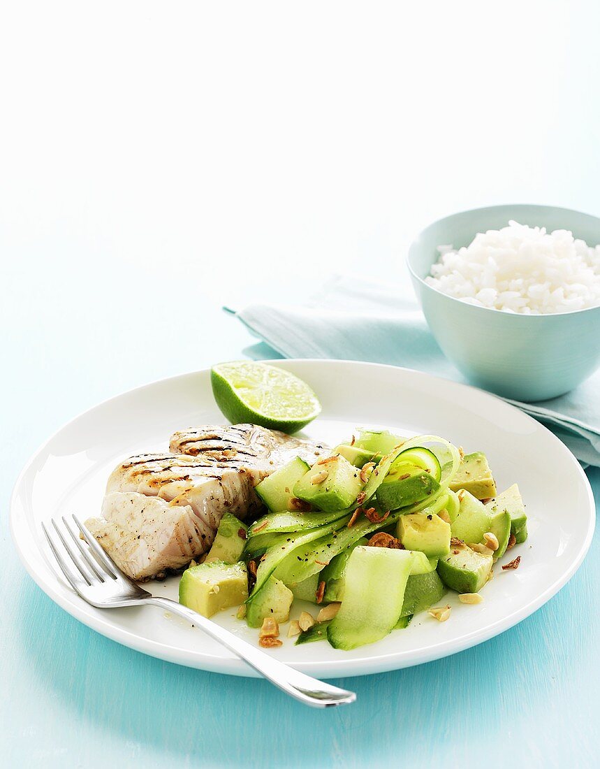 Grilled fillet of fish with an avocado and cucumber salad