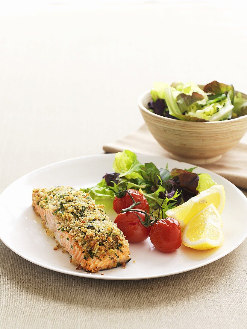 Salmon in herb and breadcrumb crust with baked tomatoes
