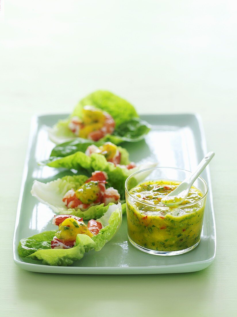 Prawns on lettuce leaves with mango salsa