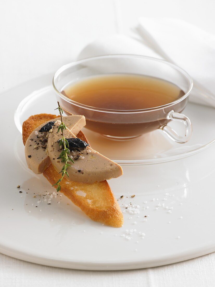 Spiced duck tea with duck liver crostini