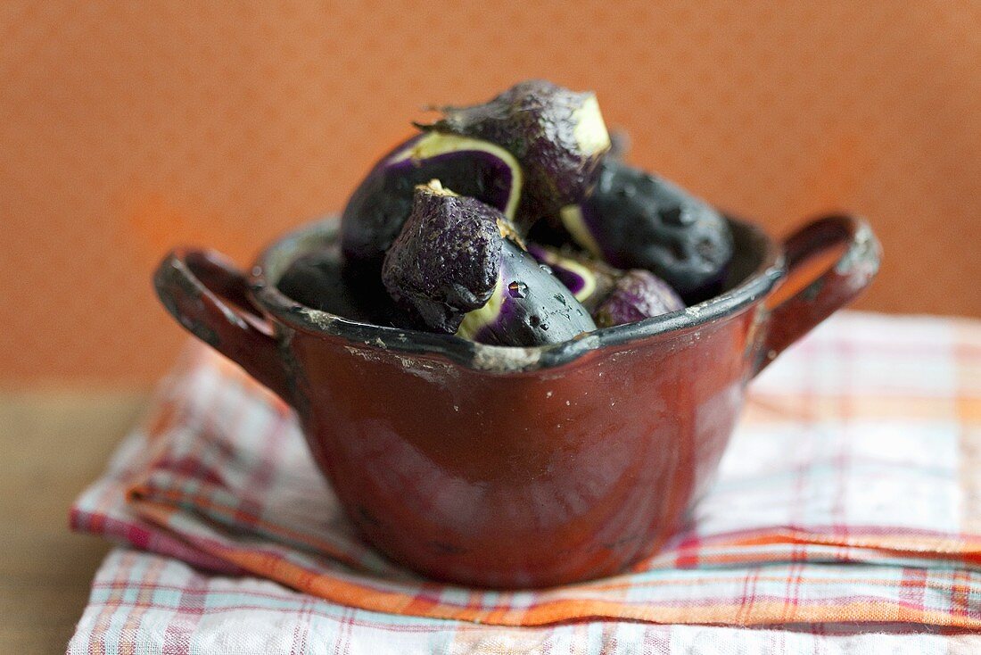 Aubergines in an enamel pot