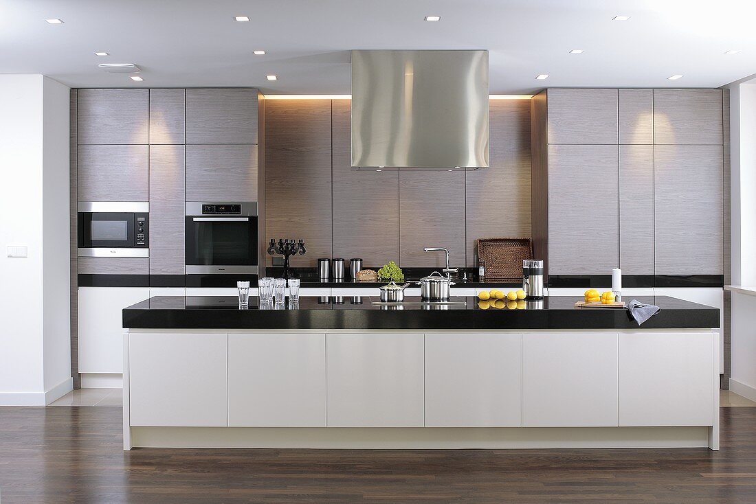 Modern designer kitchen with stainless steel cupboards and kitchen island