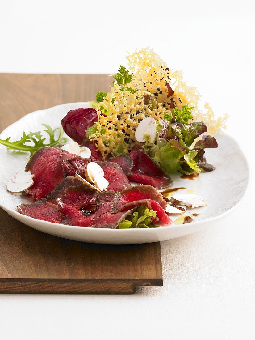 Salt beef with button mushrooms and Parmesan crisps