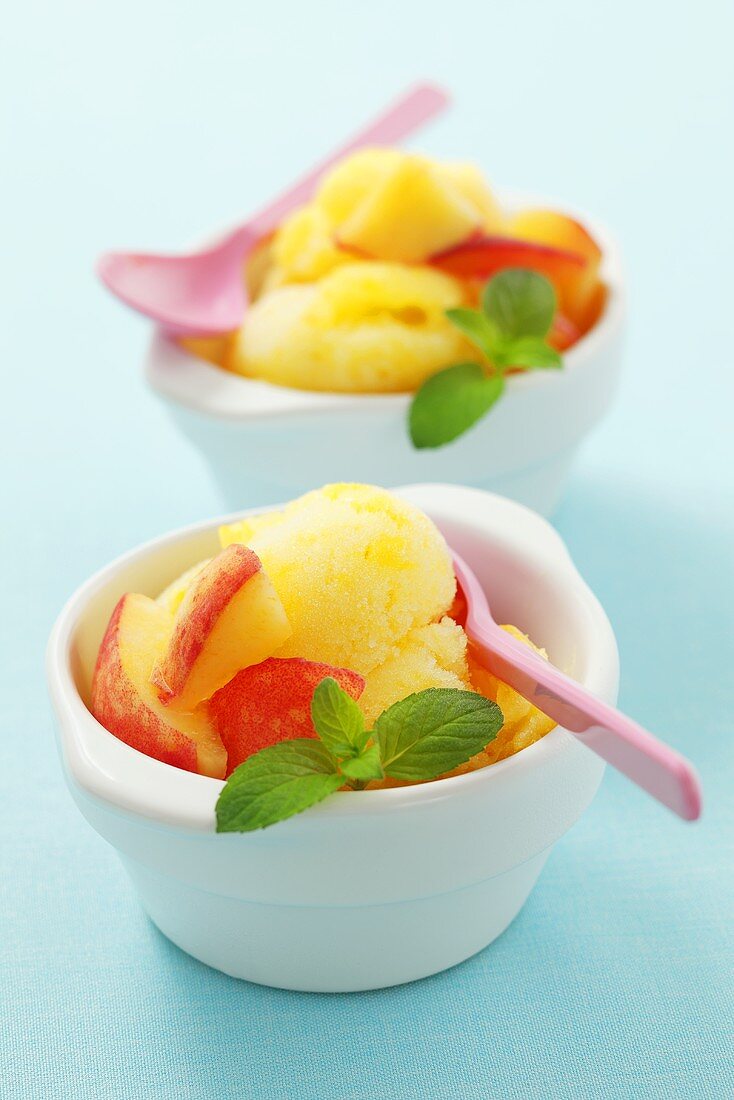 Peach sorbet with mint leaves