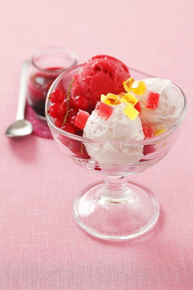 Ice cream sundae with jelly cubes and redcurrants