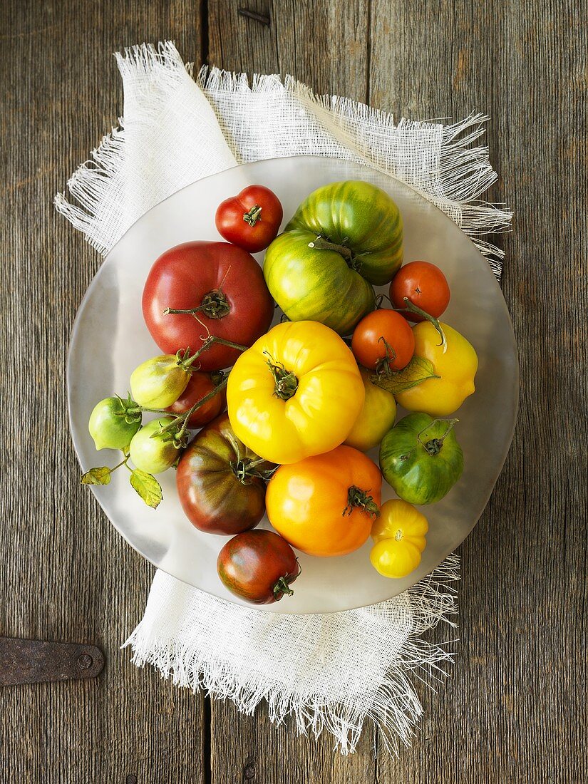 A variety of tomatoes on a plate