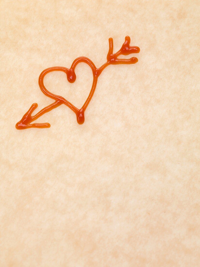 Heart with arrow drawn in ketchup