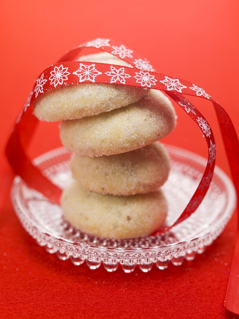 Christmas biscuits, stacked, with red ribbon