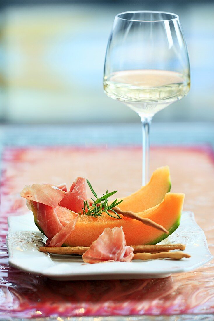 Melon with Parma ham and grissini