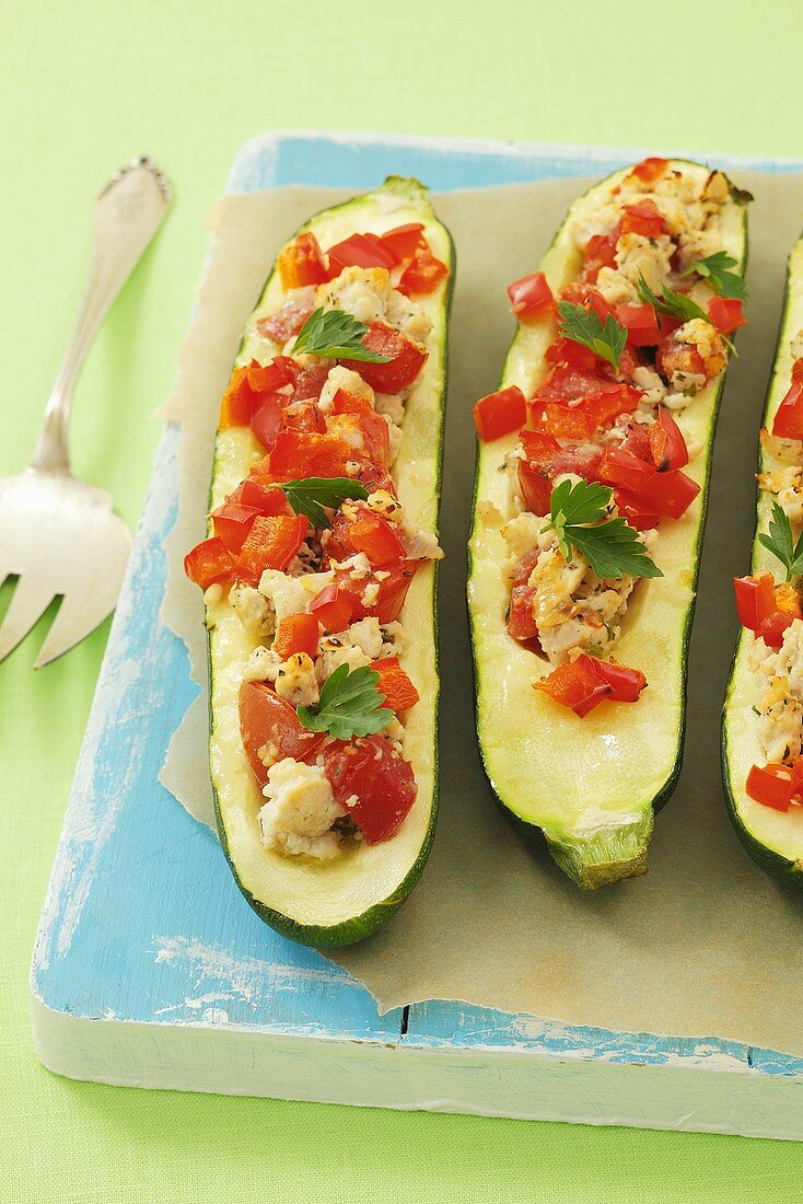 Courgettes stuffed with minced chicken, peppers and tomatoes